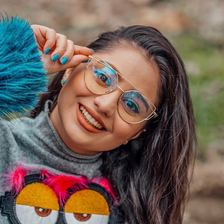 Kaveri Mehta, Lead Design Curator at Garden Crest Studio, reviewing corporate floral arrangements